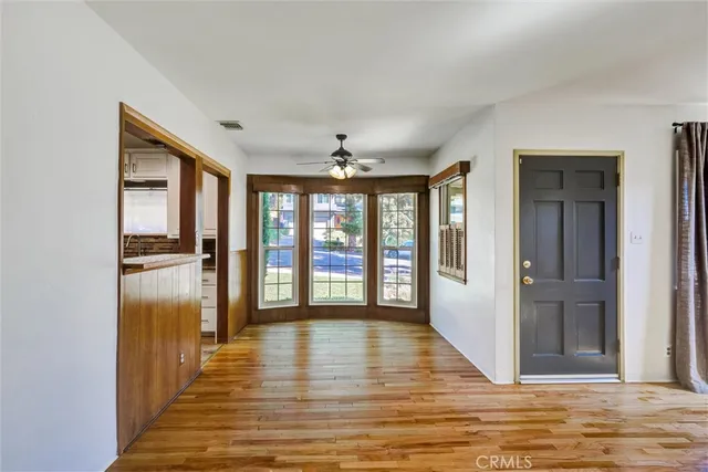 a view of a room with wooden floor and balcony