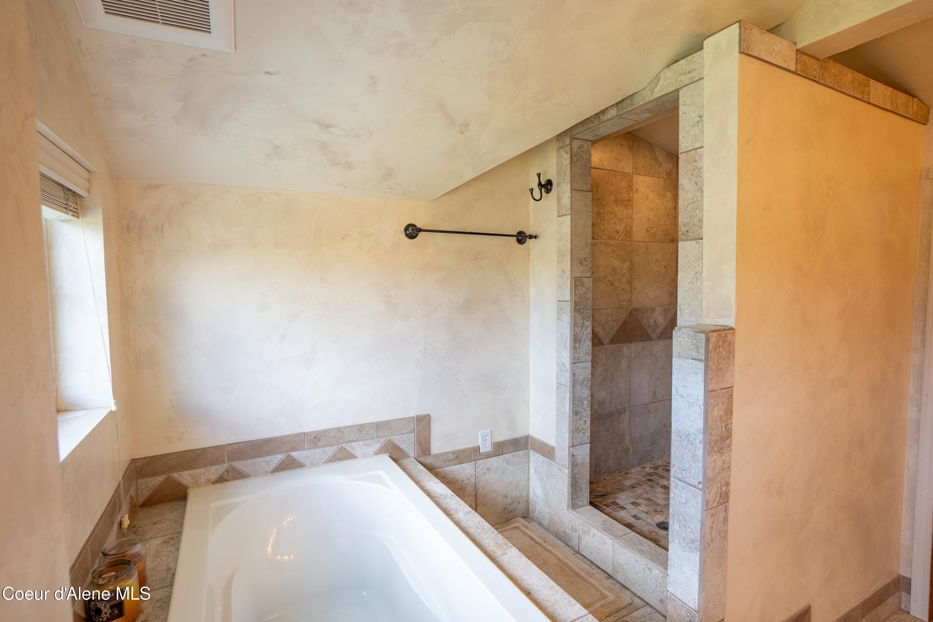 101 Zimmerman Road Moyie Springs, ID 83845 - Photo 20 of 39 Tiled Shower and soaker tub in upstairs