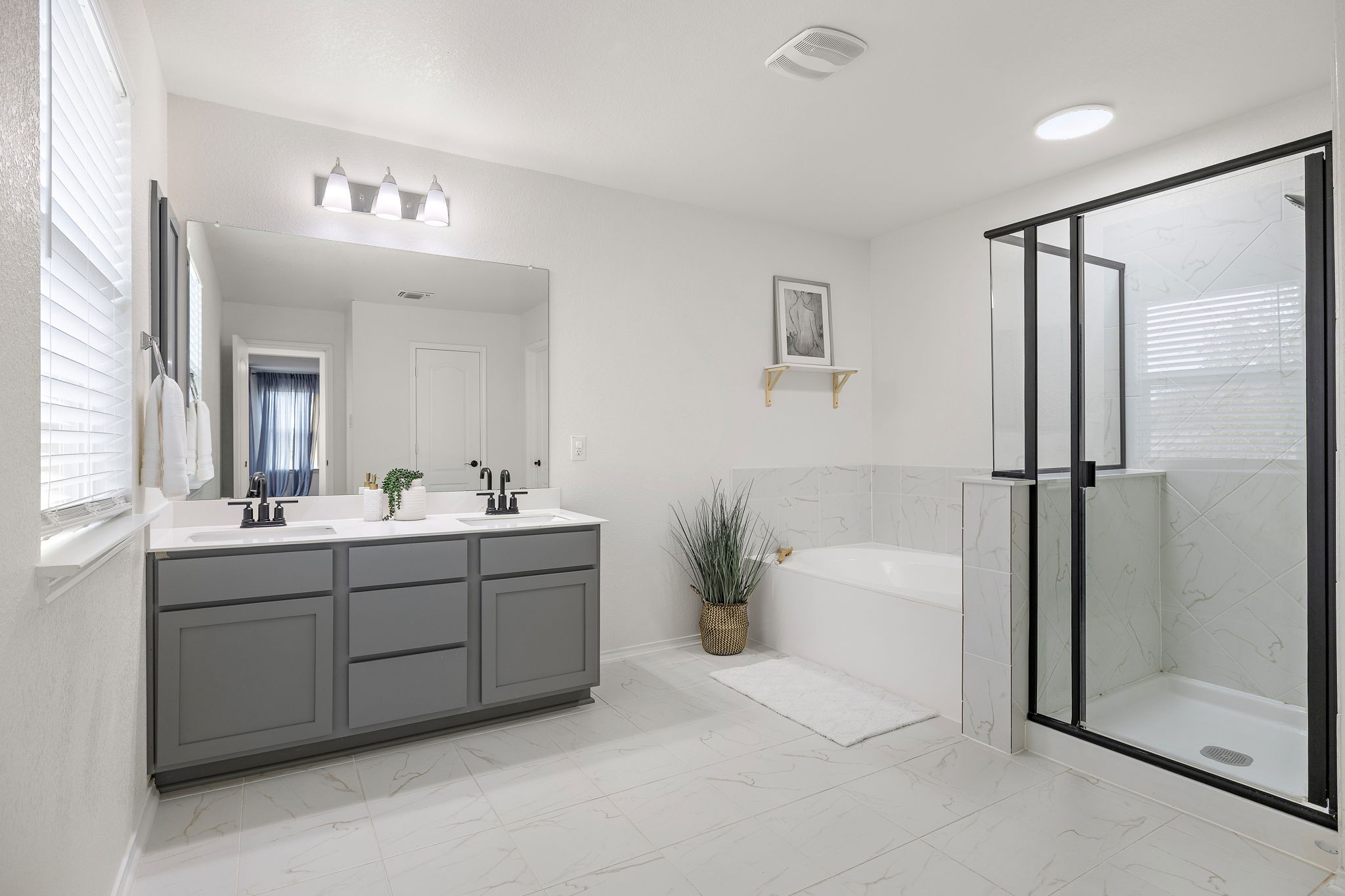 717 Priscilla Court Leander, TX 78641 - Photo 22 of 37 Primary bath upgrades added soaking tub and extra cabinets!