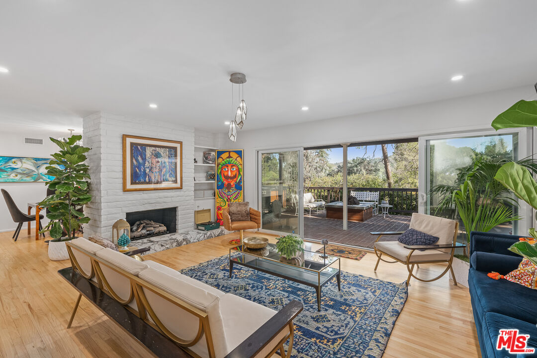 1534 Belleau Road Glendale, CA 91206 - Photo 20 of 40 a living room with furniture large window and potted plants