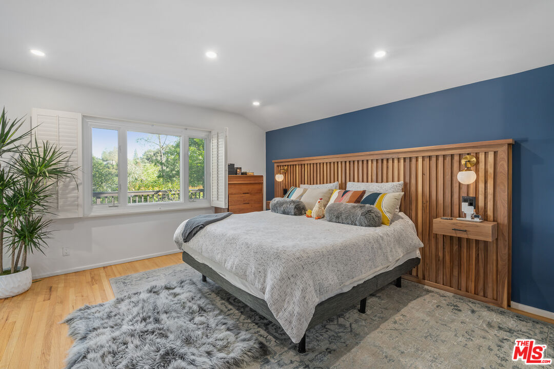 1534 Belleau Road Glendale, CA 91206 - Photo 24 of 40 a bed sitting in a spacious bedroom next to a window