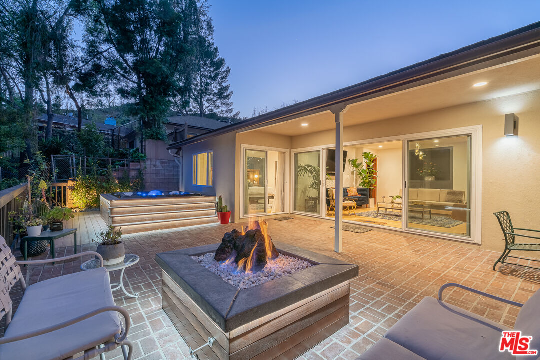 1534 Belleau Road Glendale, CA 91206 - Photo 30 of 40 a view of a patio with couches chairs and wooden floor