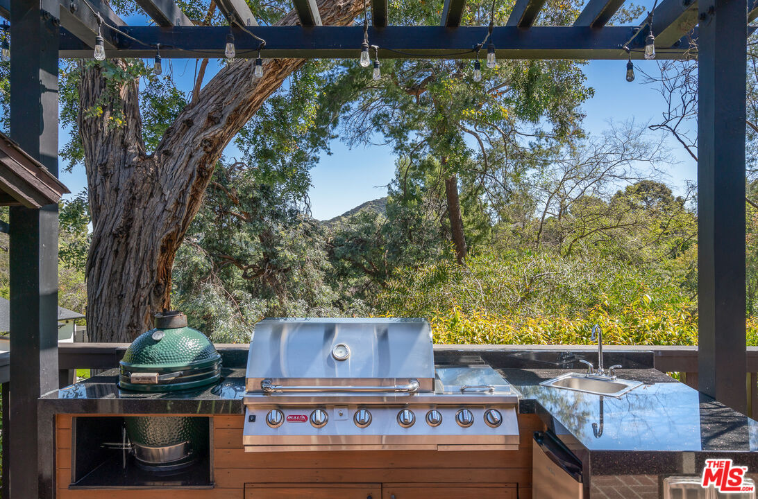 1534 Belleau Road Glendale, CA 91206 - Photo 34 of 40 a view of a balcony with wooden floor and a tree