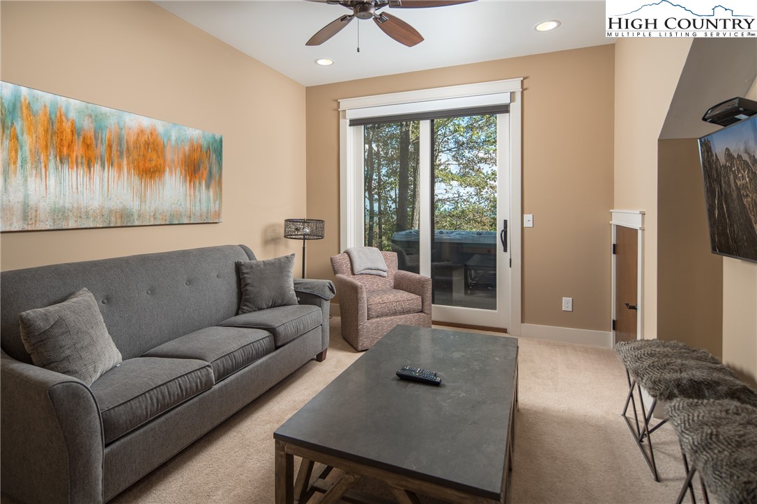 1253 Goldenrod Road Boone, NC 28607 - Photo 18 of 48 a living room with furniture and a large window