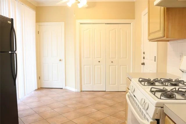 a view of a kitchen with a stove top oven