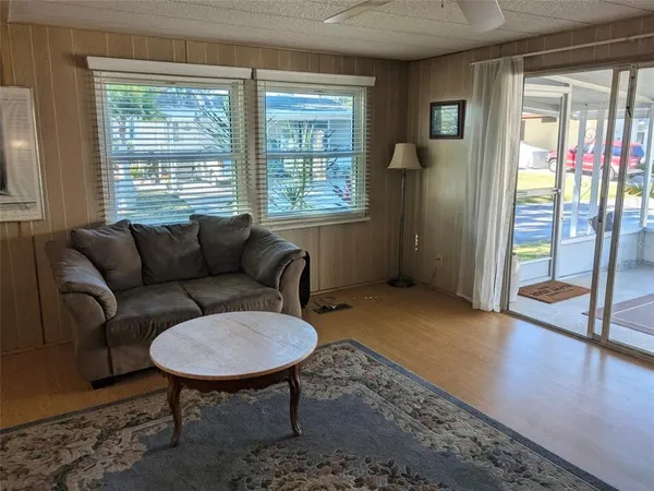 a living room with furniture and a window