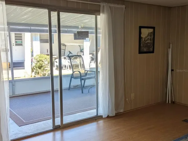 a view of a room that has a bed and a window