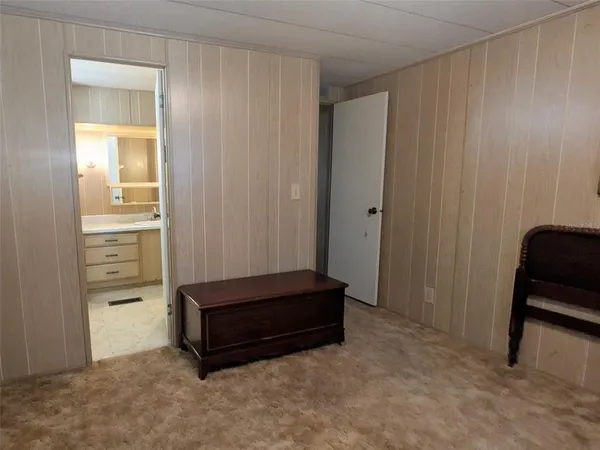 a room with a bench and a mirror