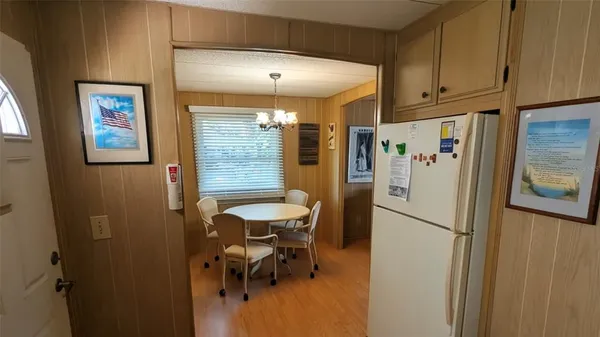 a white refrigerator freezer sitting inside of a kitchen