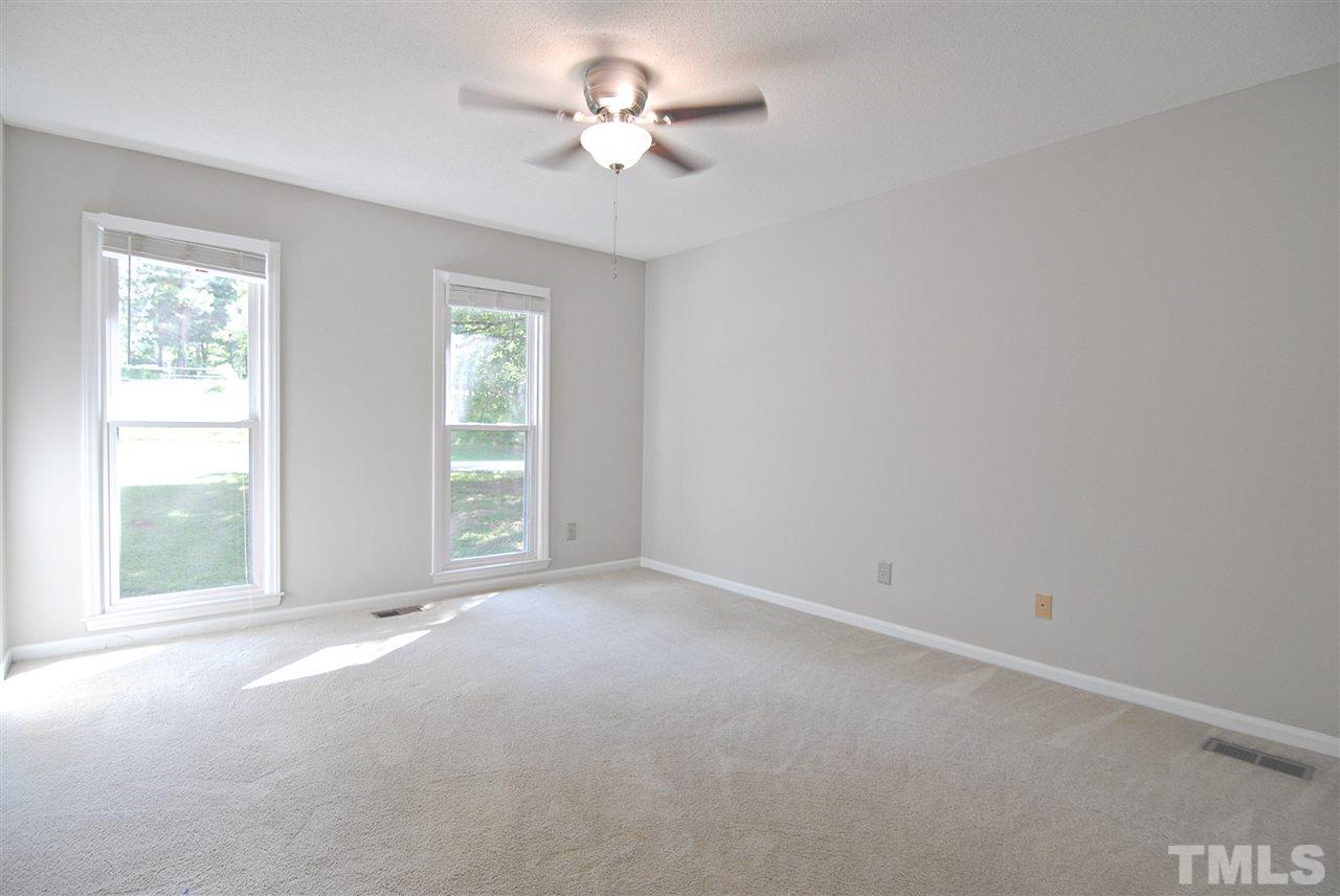 1716 Park Ridge Way Raleigh, NC 27614 - Photo 14 of 24 wooden floor in an empty room with a window