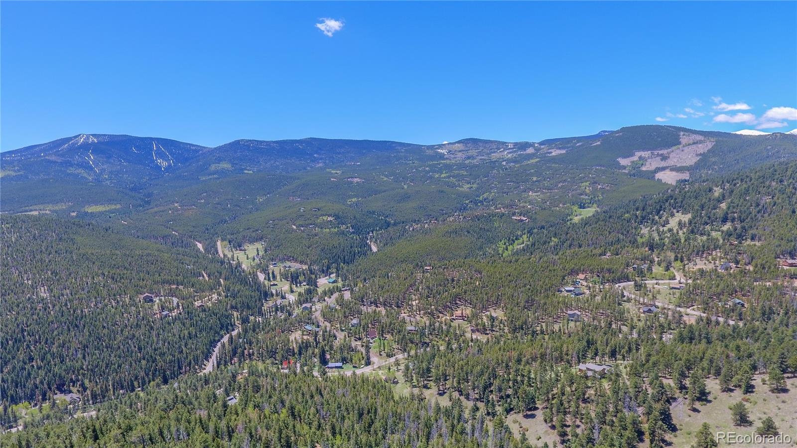 7291 Timber Trail Road Evergreen, CO 80439 - Photo 4 of 7 a view of a city with mountain