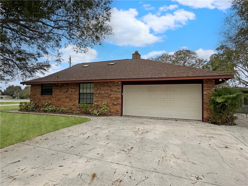 6602 Eden Road Fort Pierce, FL 34951 - Photo 23 of 24 a front view of a house with a yard