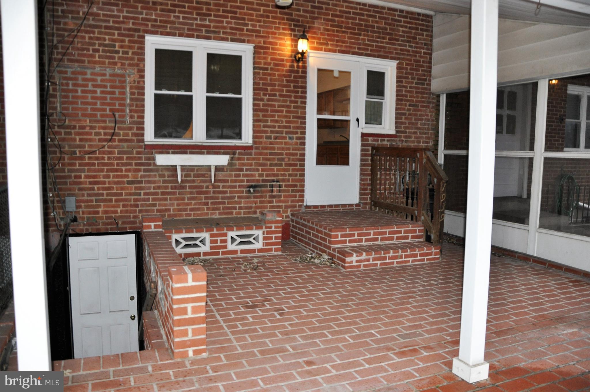 1939 Ormand Road Baltimore, MD 21222 - Photo 22 of 26 a view of a brick house with a door and wooden floor