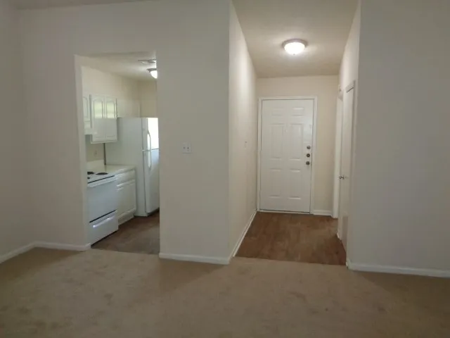 an empty room with a bathroom