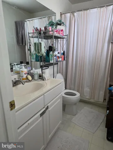a kitchen with a white cabinets and white appliances