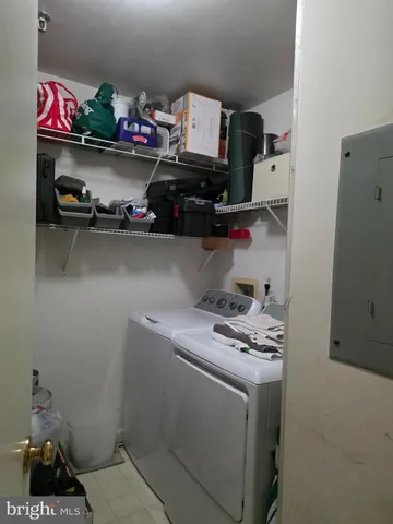 a view of a dining room with furniture a chandelier and wooden floor