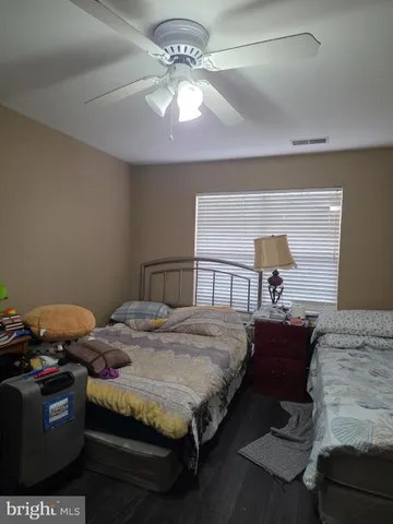 a view of a balcony with couches and pool table and chairs