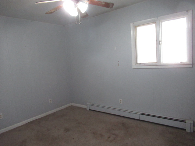 114 North Chase Street Monticello, IL 61856 - Photo 4 of 13 an empty room with a window