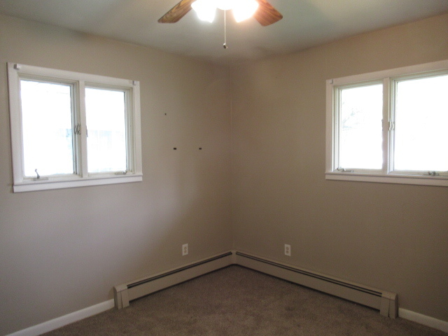 114 North Chase Street Monticello, IL 61856 - Photo 7 of 13 an empty room with a window