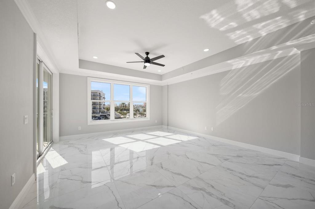 211 Dolphin Point, Unit 301 Clearwater, FL 33767 - Photo 12 of 48 a view of an empty room with a window