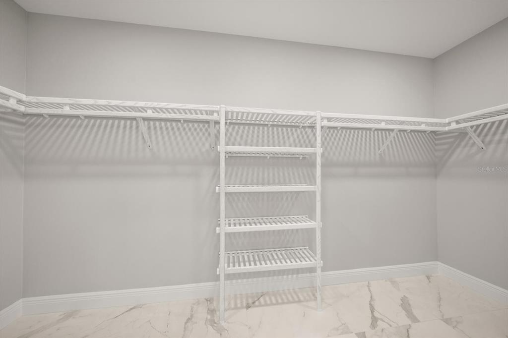 211 Dolphin Point, Unit 301 Clearwater, FL 33767 - Photo 20 of 48 a view of a room with rack on the wall