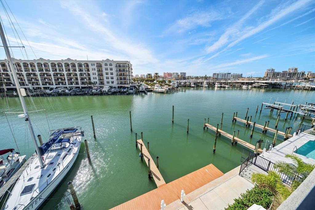 211 Dolphin Point, Unit 301 Clearwater, FL 33767 - Photo 29 of 48 a view of a lake with a city