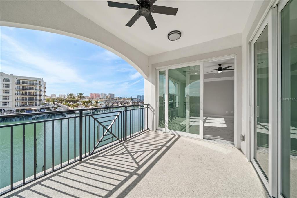 211 Dolphin Point, Unit 301 Clearwater, FL 33767 - Photo 9 of 48 a balcony view with a ocean view