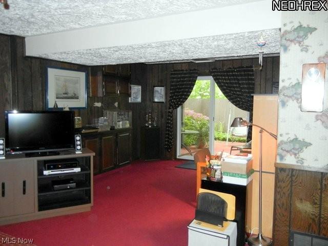 4210 Slaughter Road Uniontown, OH 44685 - Photo 22 of 25 Family room showing sliding door to patio.