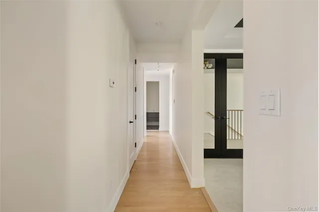 a bedroom with two beds and a window