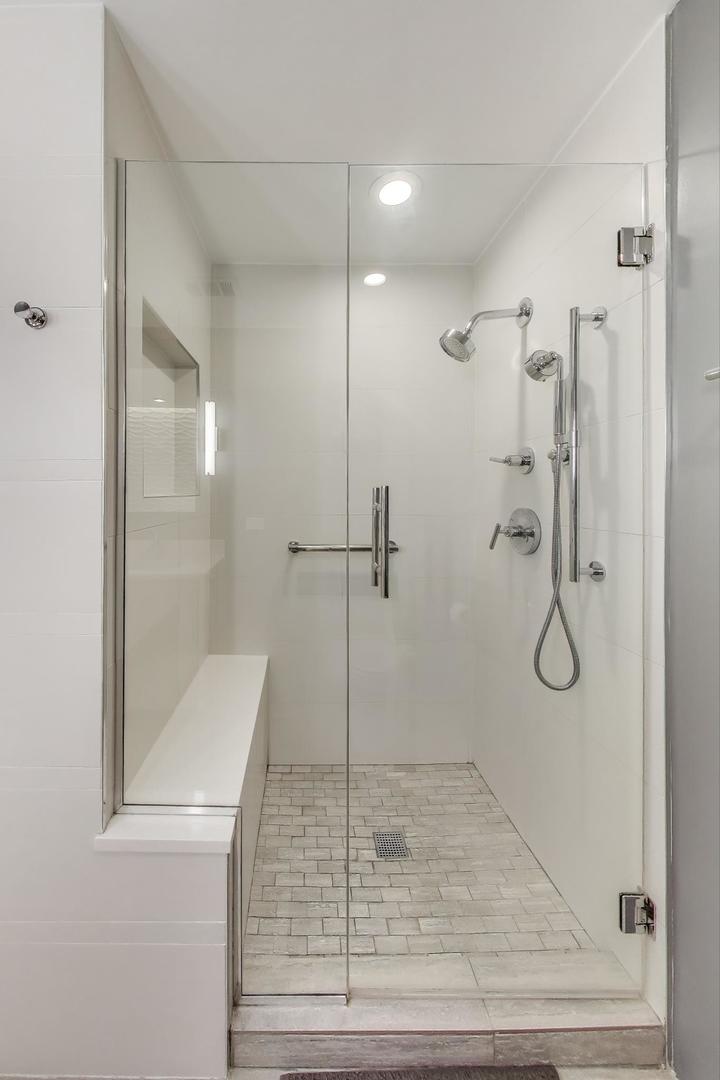 520 North Halsted Street, Unit 410 Chicago, IL 60642 - Photo 15 of 31 a bathroom with a glass shower door
