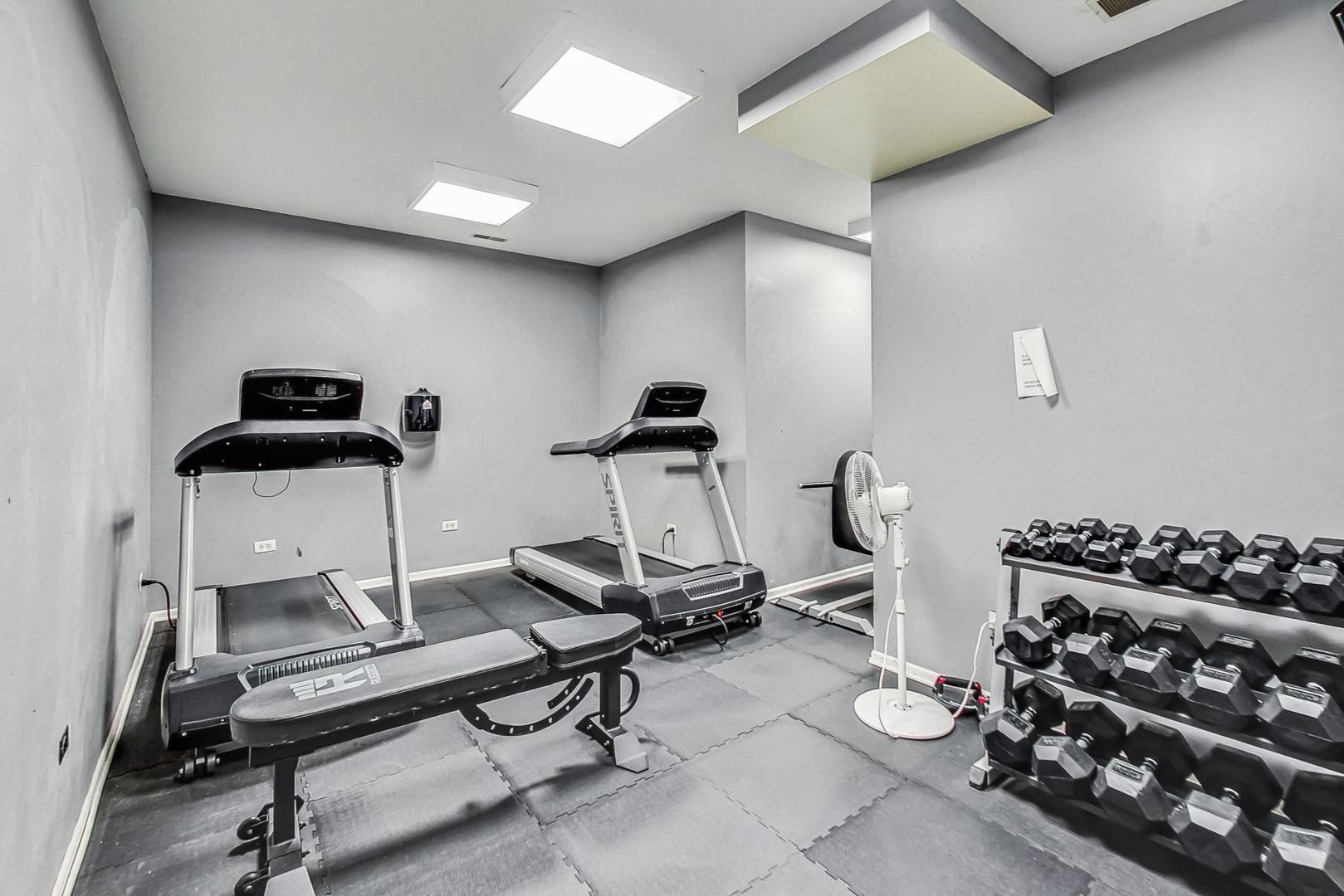 520 North Halsted Street, Unit 410 Chicago, IL 60642 - Photo 25 of 31 a view of a room with gym equipment