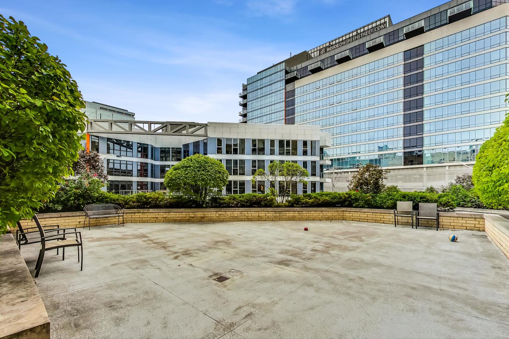 520 North Halsted Street, Unit 410 Chicago, IL 60642 - Photo 26 of 31 a front view of a house with a yard