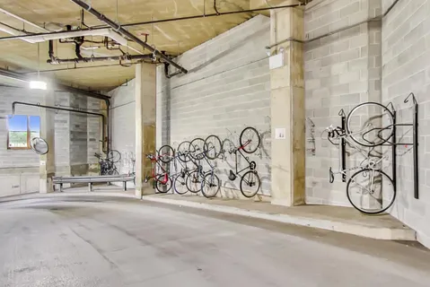 a view of parking garage with cars