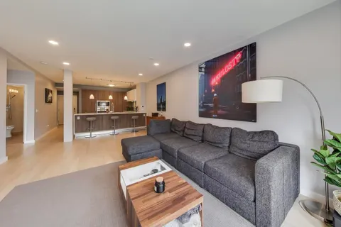 a living room with furniture and a table