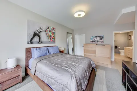 a bedroom with a bed and a walk in closet