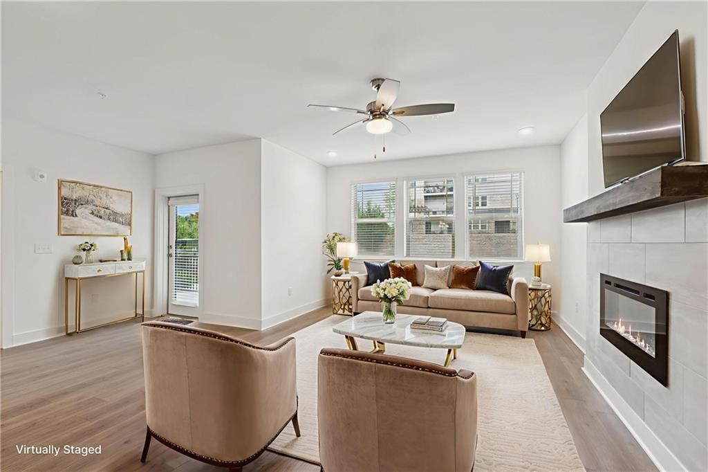 a living room with furniture and a fireplace