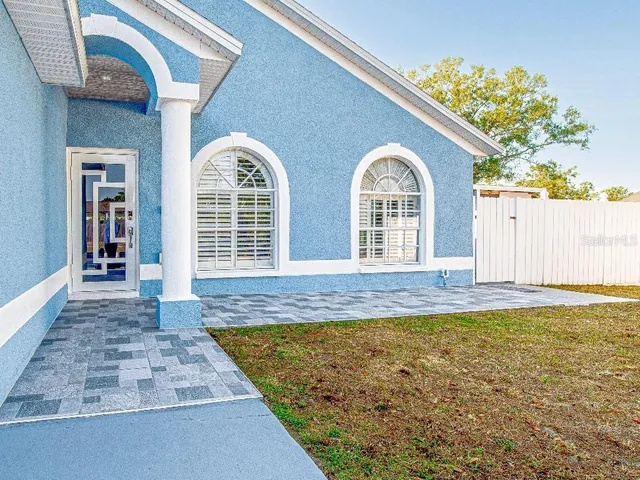 a view of swimming pool with potted plants