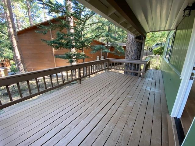 25011 Rim Rock Road Idyllwild, CA 92549 - Photo 22 of 40 a view of balcony with wooden floor and outdoor seating