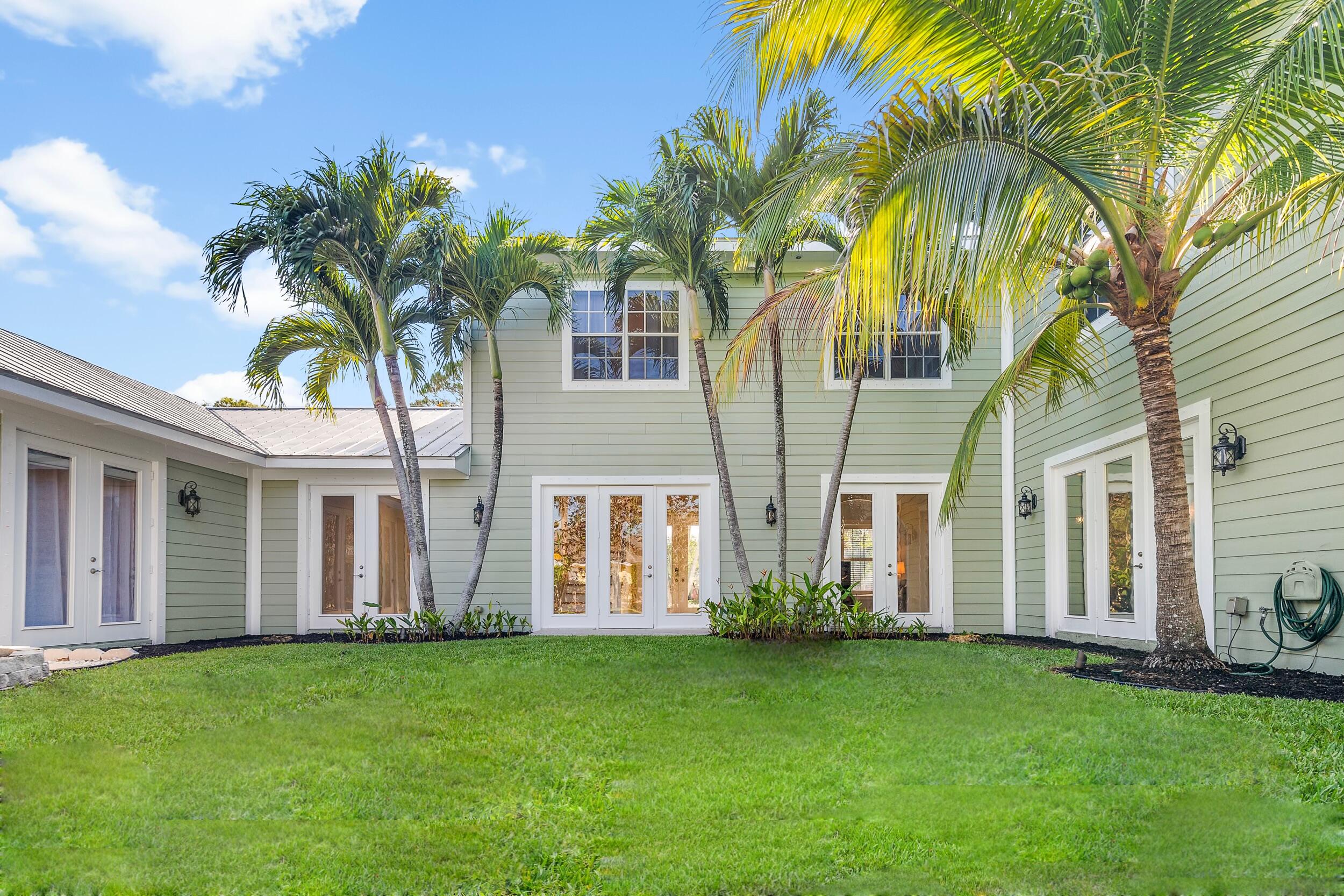 19067 Southeast County Line Road Jupiter, FL 33469 - Photo 65 of 93 Backyard Courtyard