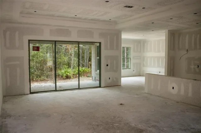 a view of an empty room with a sliding door