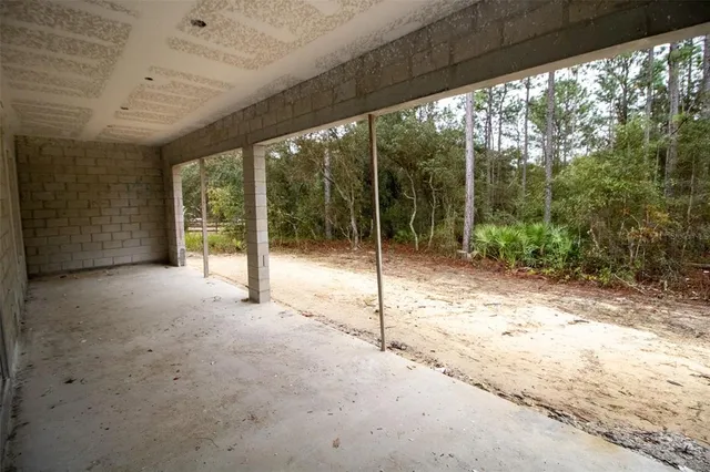 a view of a house with porch and mountain view