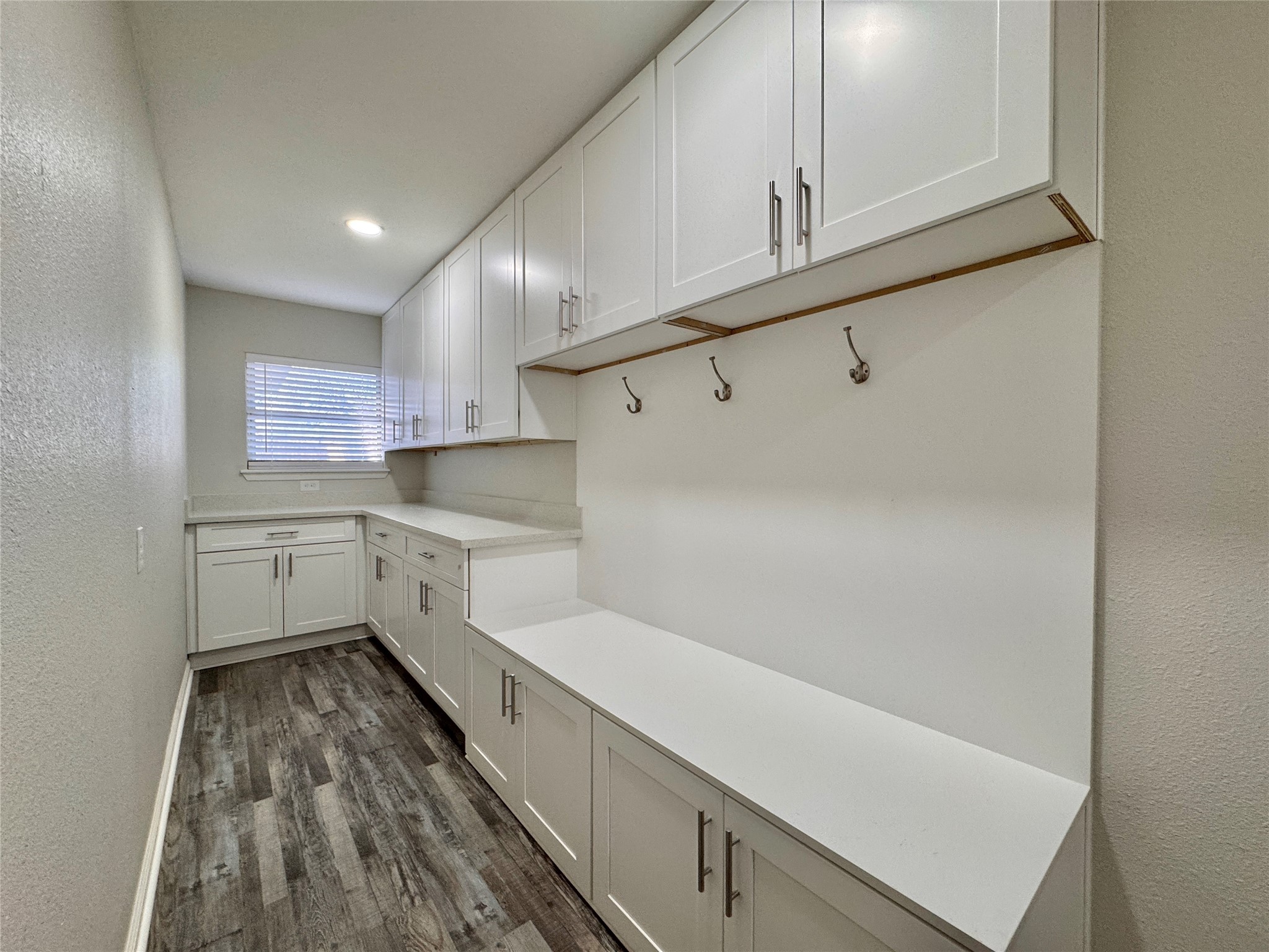 5115 Hialeah Drive Houston, TX 77092 - Photo 11 of 21 a kitchen with white cabinets and white appliances