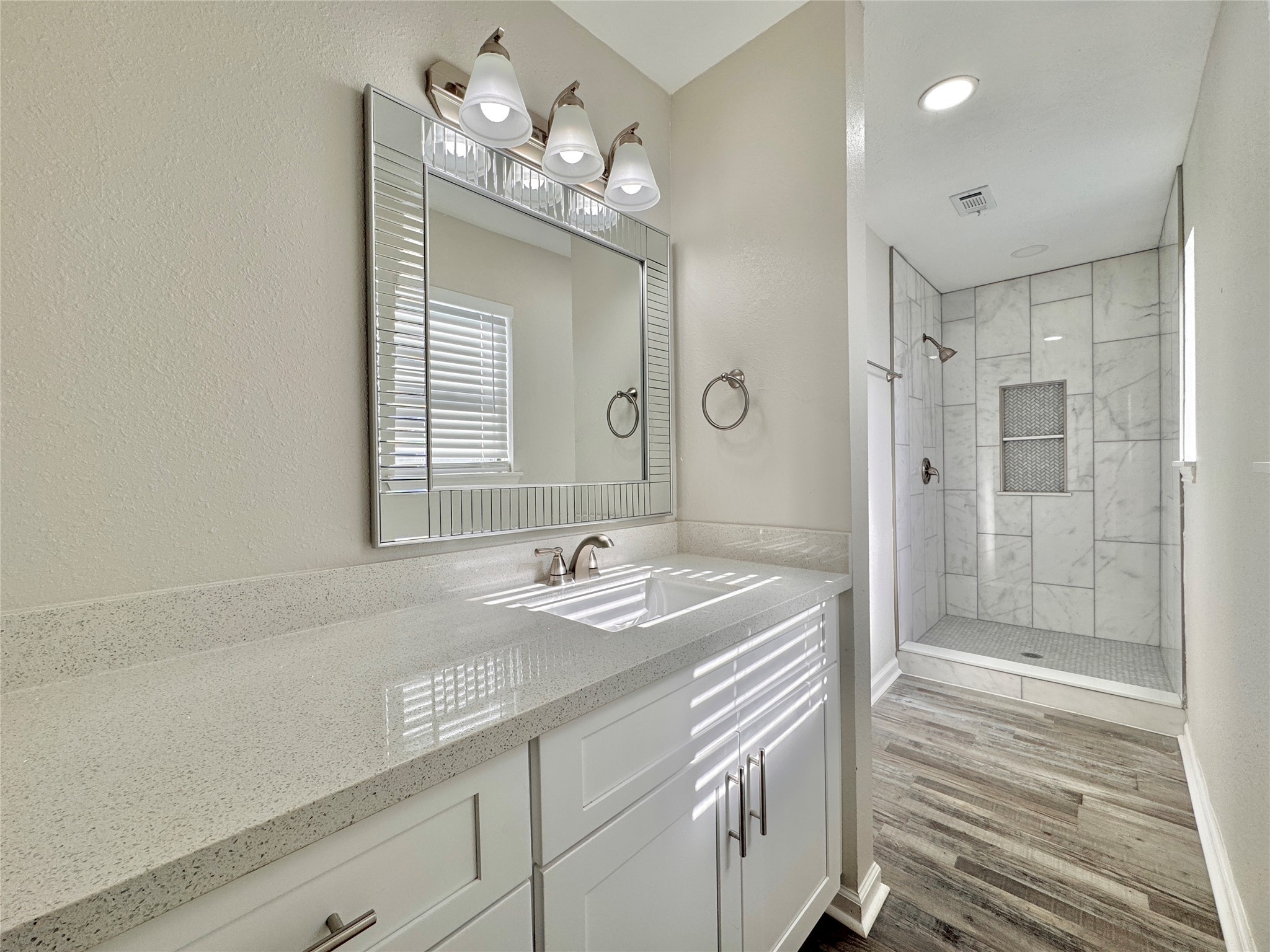 5115 Hialeah Drive Houston, TX 77092 - Photo 13 of 21 a bathroom with a sink double vanity and shower