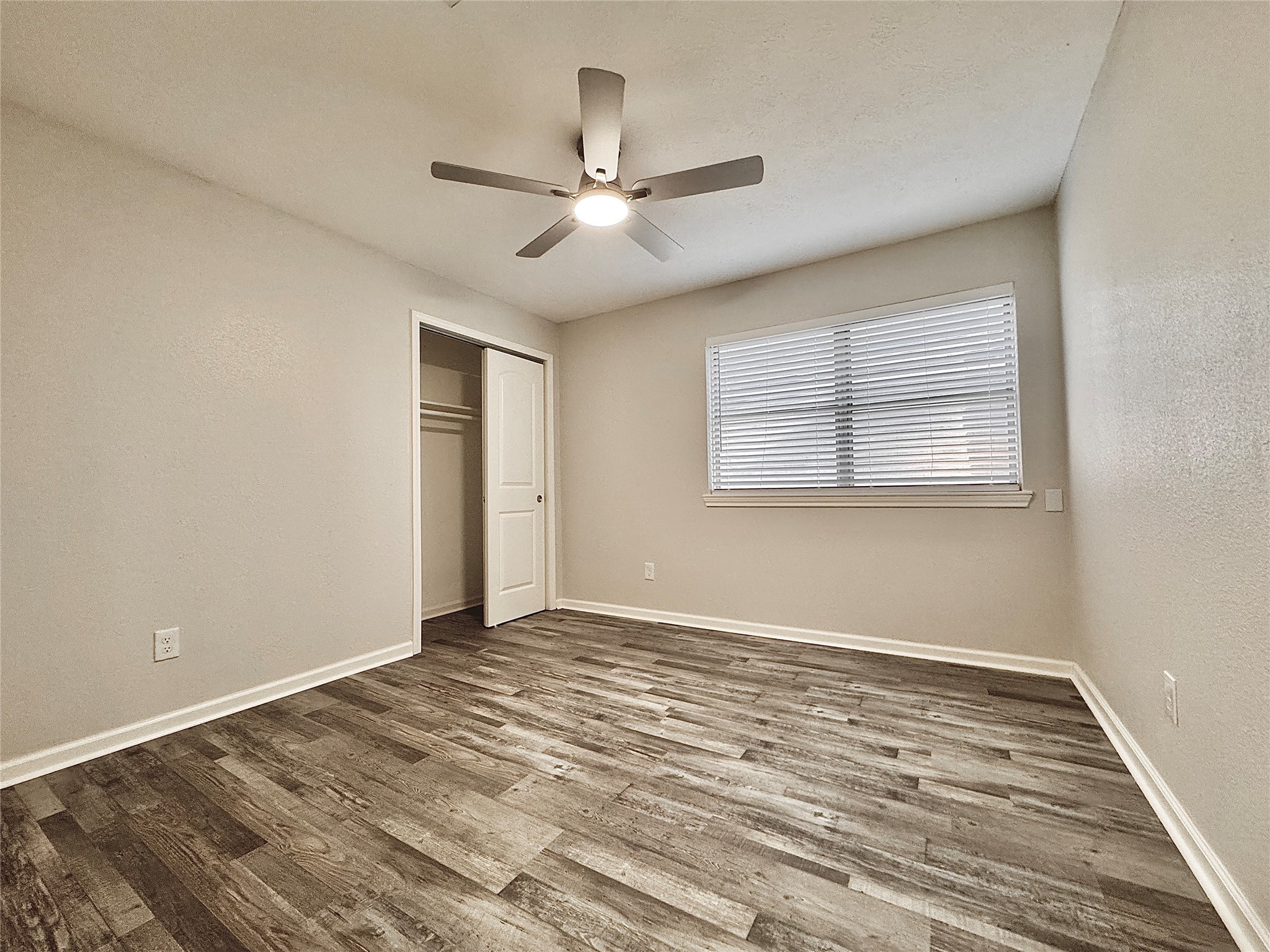5115 Hialeah Drive Houston, TX 77092 - Photo 15 of 21 a view of an empty room with wooden floor and a window