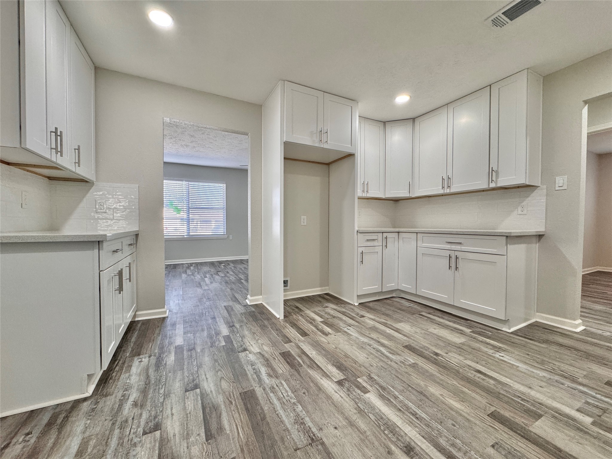 5115 Hialeah Drive Houston, TX 77092 - Photo 3 of 21 a view of a kitchen with wooden floor and a sink