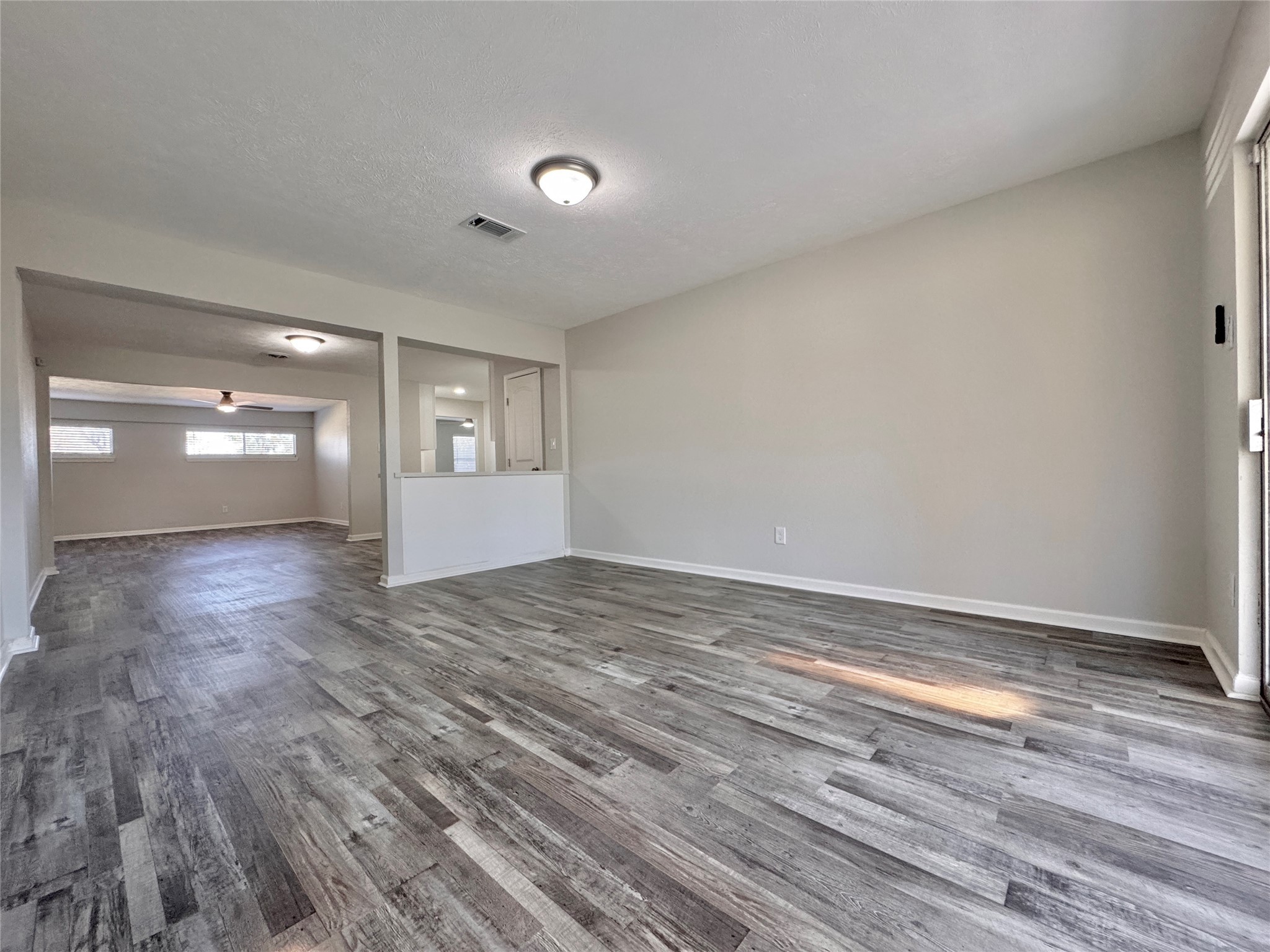 5115 Hialeah Drive Houston, TX 77092 - Photo 8 of 21 a view of empty room with wooden floor and fan