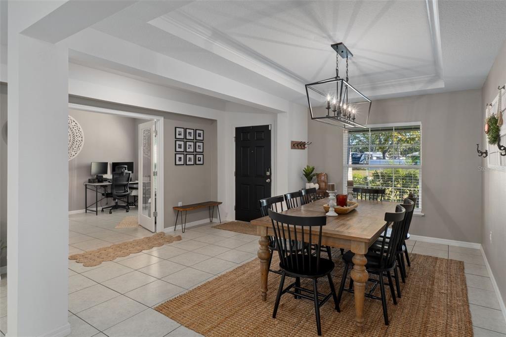 3313 Dorian Avenue Spring Hill, FL 34606 - Photo 14 of 57 a view of a dining room with furniture and wooden floor