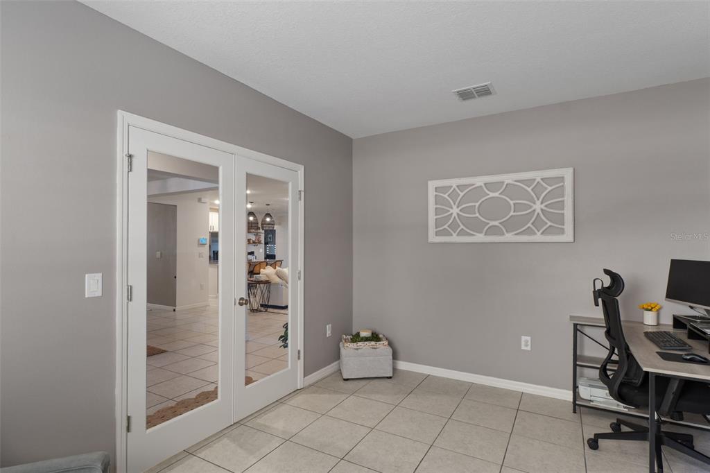 3313 Dorian Avenue Spring Hill, FL 34606 - Photo 17 of 57 a view of room with workspace and bathroom