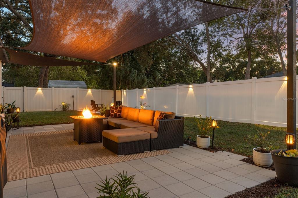 3313 Dorian Avenue Spring Hill, FL 34606 - Photo 2 of 57 a view of a patio with couches chairs and a fire pit