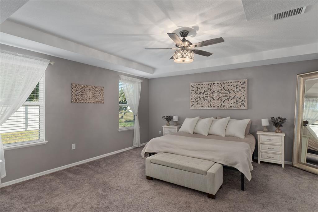 3313 Dorian Avenue Spring Hill, FL 34606 - Photo 22 of 57 a bed room with a bed and a chandelier
